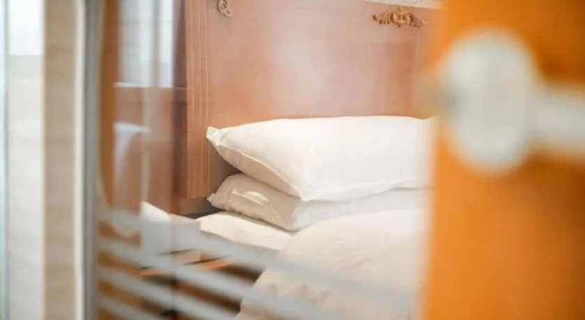 Bed in Vienna International Hotel Wuhan Huanghelou Pengliuyang Metro Station
