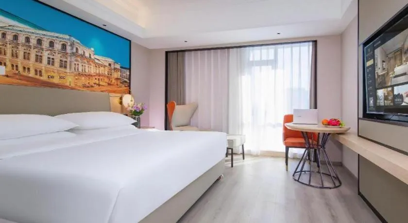 Bed in Vienna International Hotel Wuhan Huanghelou Pengliuyang Metro Station