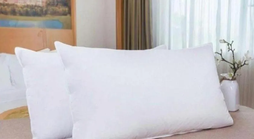 Bed in Vienna International Hotel Wuhan Huanghelou Pengliuyang Metro Station