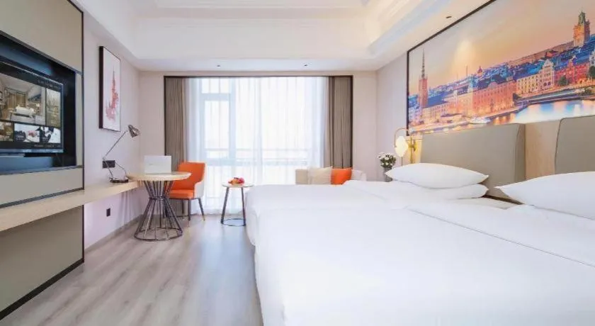 Bed in Vienna International Hotel Wuhan Huanghelou Pengliuyang Metro Station