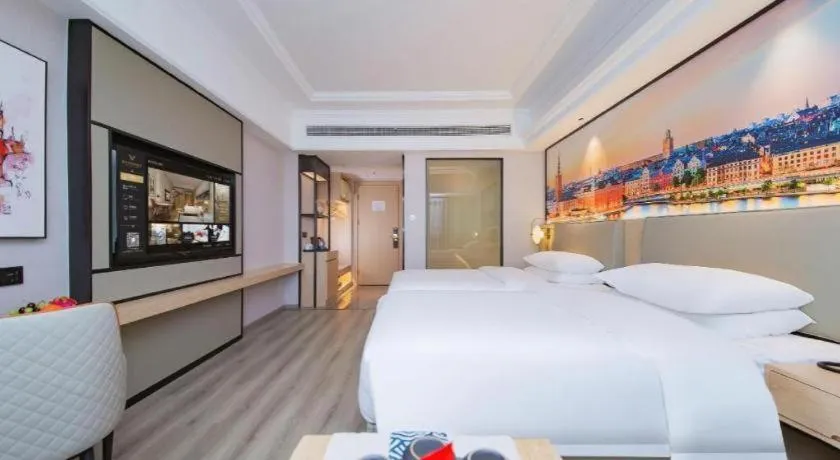 Bed in Vienna International Hotel Wuhan Huanghelou Pengliuyang Metro Station