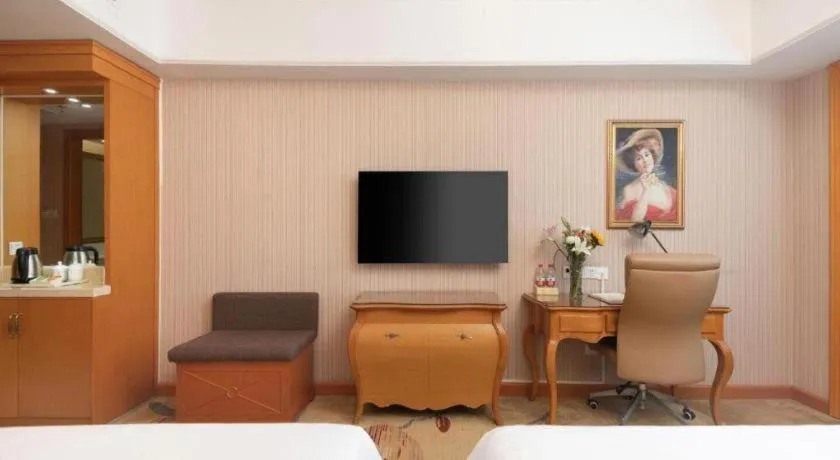 Bed in Vienna International Hotel Wuhan Huanghelou Pengliuyang Metro Station