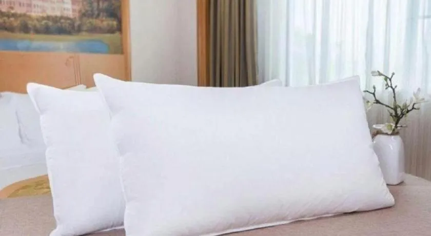 Bed in Vienna International Hotel Wuhan Huanghelou Pengliuyang Metro Station