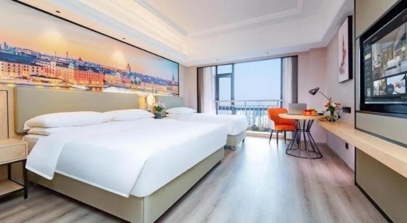 Bed in Vienna International Hotel Wuhan Huanghelou Pengliuyang Metro Station