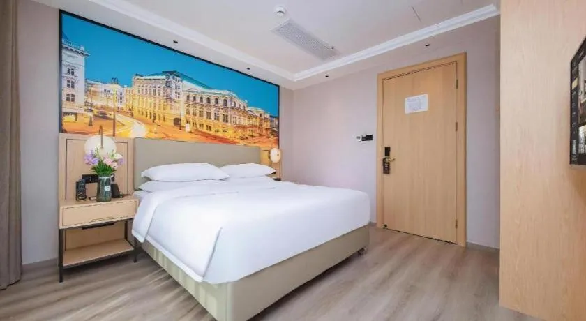 Bed in Vienna International Hotel Wuhan Huanghelou Pengliuyang Metro Station