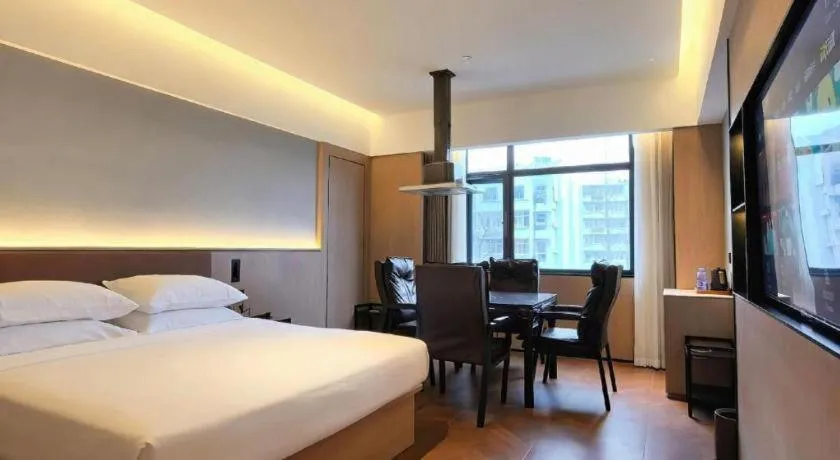 Bed in Vienna International Hotel Wuhan Huanghelou Pengliuyang Metro Station