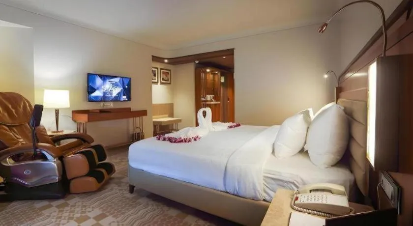 Bed in The Grandeur Boutique Hotel