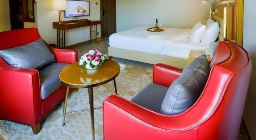 Bed in The Grandeur Boutique Hotel