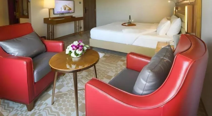 Bed in The Grandeur Boutique Hotel