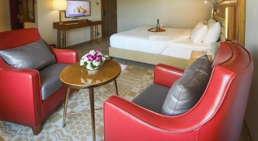 Bed in The Grandeur Boutique Hotel