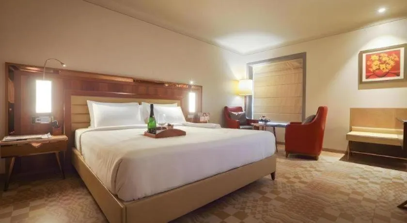 Bed in The Grandeur Boutique Hotel