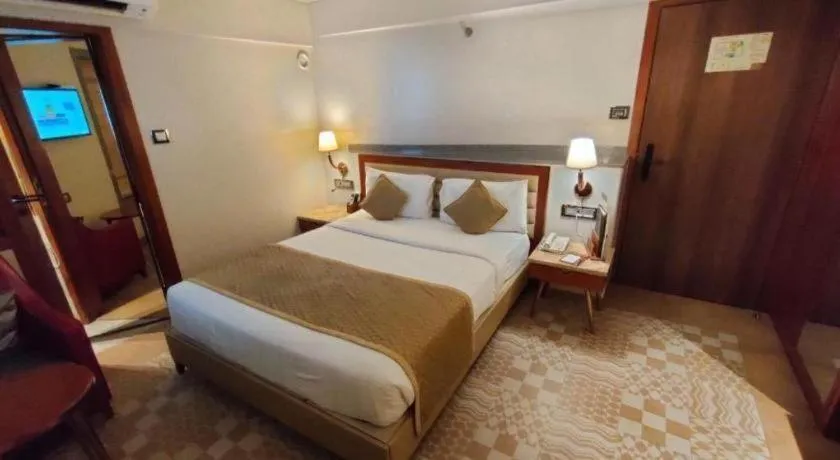 Bed in The Grandeur Boutique Hotel