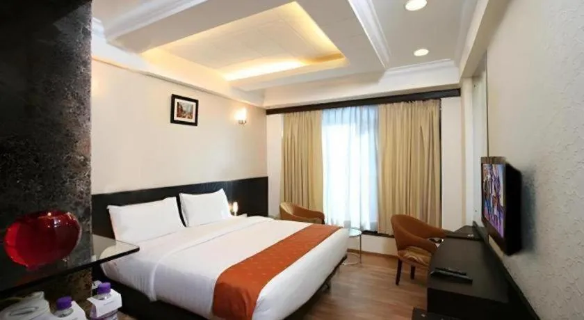 Bed in Hotel Signature Grand