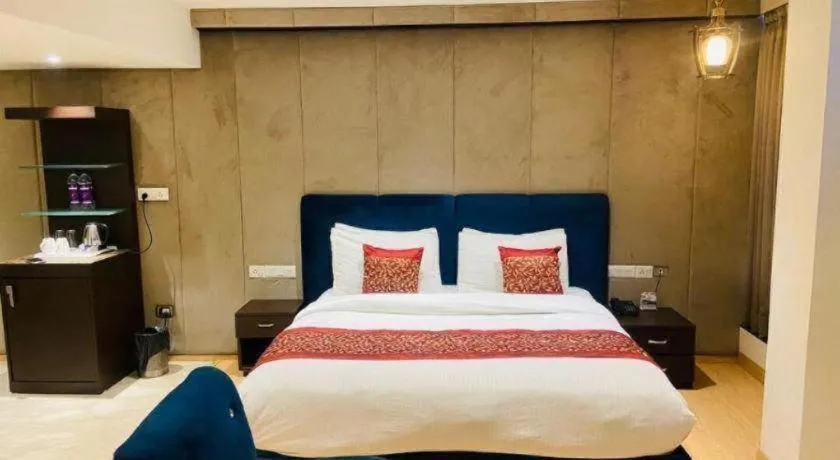 Bed in Hotel Signature Grand