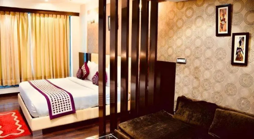 Bed in Hotel Signature Grand