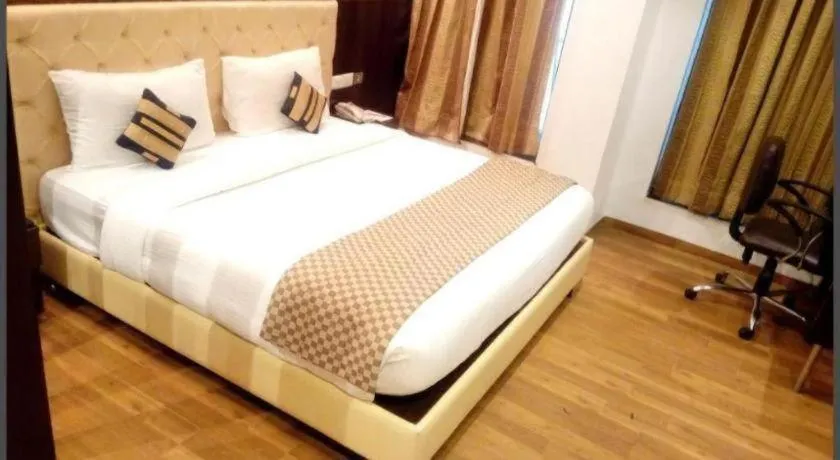 Bed in Hotel Signature Grand