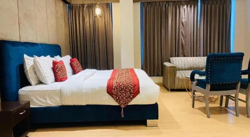 Bed in Hotel Signature Grand