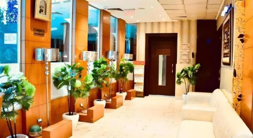 Bed in Hotel Signature Grand