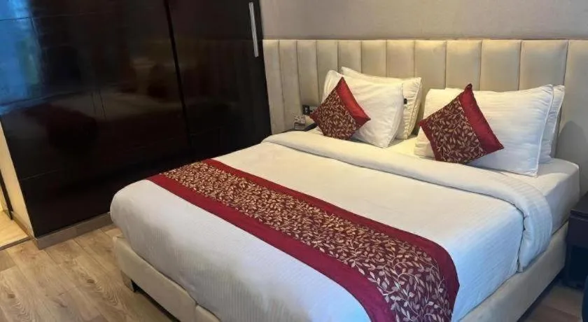 Bed in Hotel Signature Grand