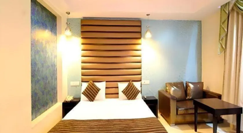 Bed in Hotel Signature Grand