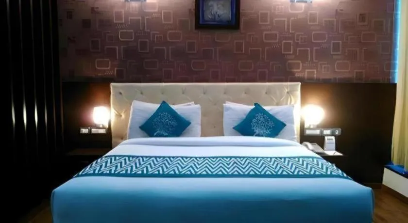 Bed in Hotel Signature Grand