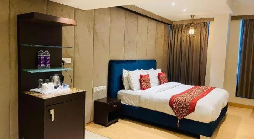 Bed in Hotel Signature Grand