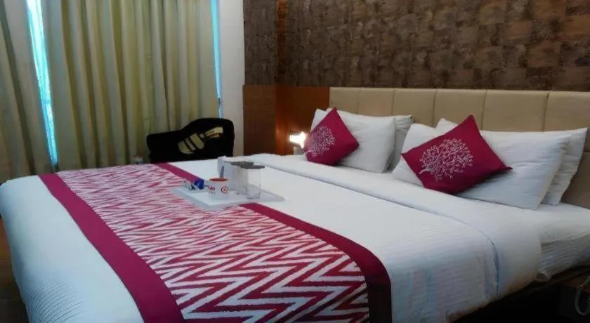 Bed in Hotel Signature Grand