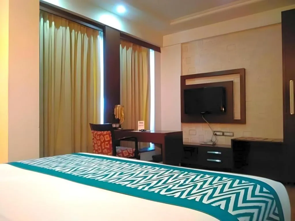 Bed in Hotel Signature Grand