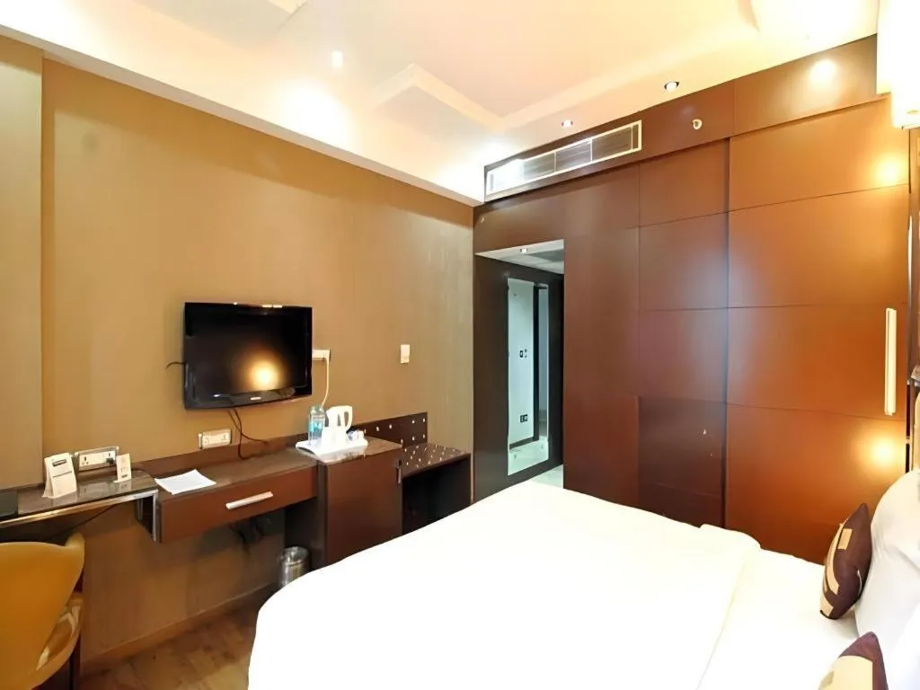 Bed in Hotel Signature Grand