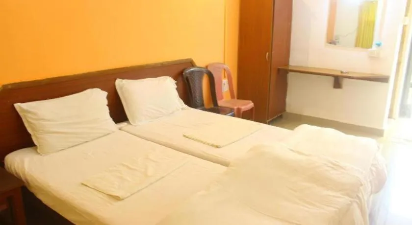 Bed in Poonam Village Resort