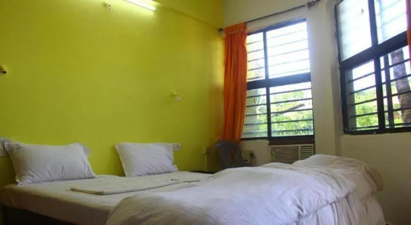 Bed in Poonam Village Resort