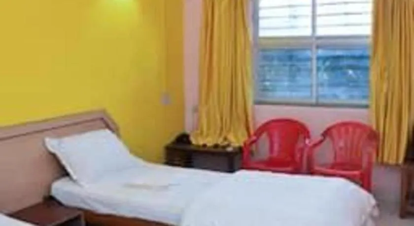 Bed in Poonam Village Resort