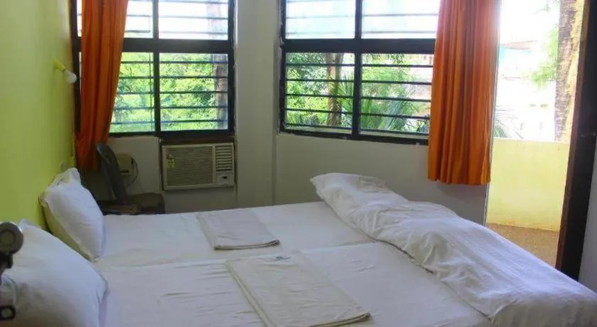 Bed in Poonam Village Resort