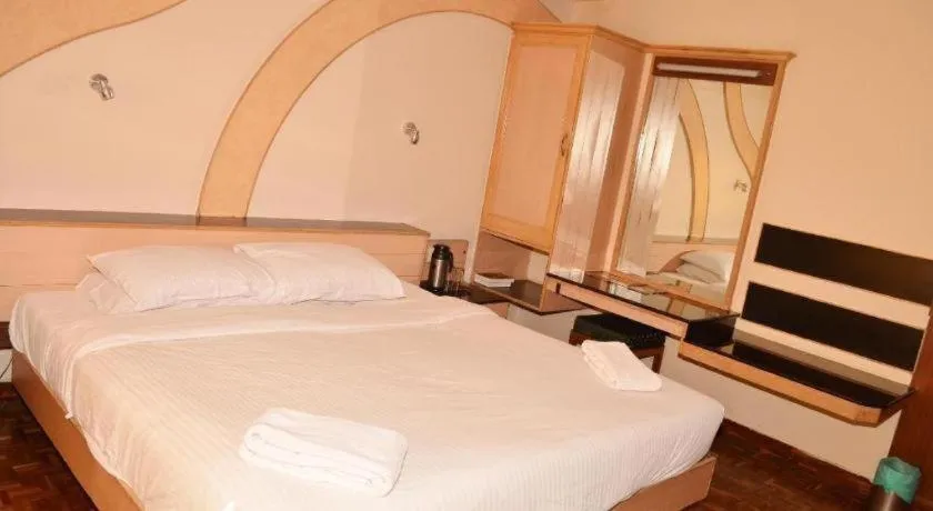 Bed in Hotel Hilltop Towers