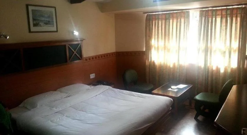 Bed in Hotel Hilltop Towers