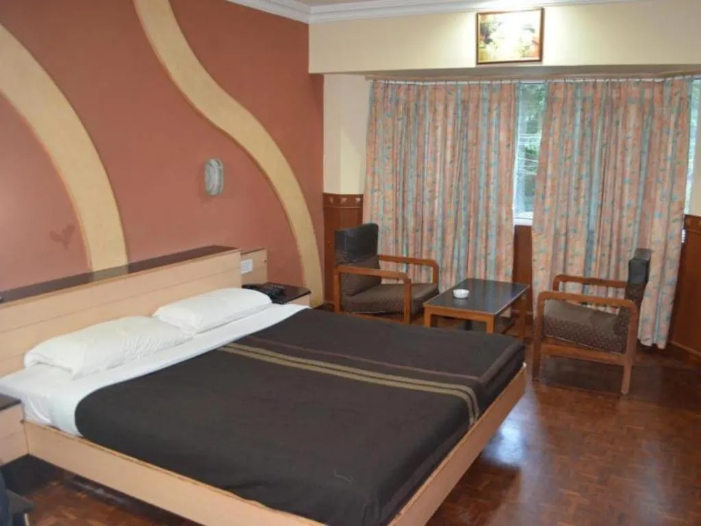 Bed in Hotel Hilltop Towers