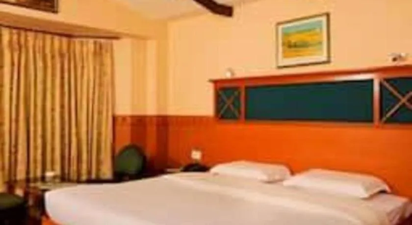 Bed in Hotel Hilltop Towers