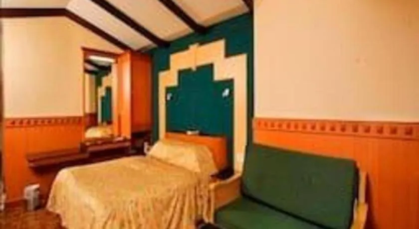 Bed in Hotel Hilltop Towers