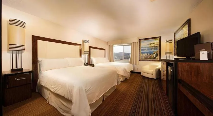 Bed in Western Village Inn And Casino