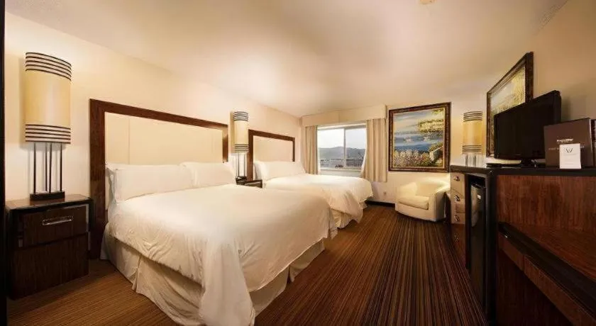 Bed in Western Village Inn And Casino