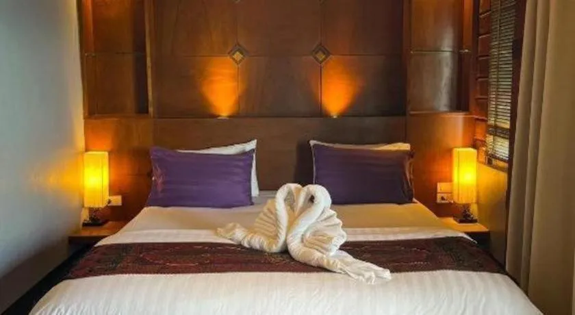 Bed in Diamond Cliff Beach Lanta Resort