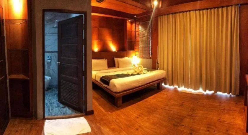 Bed in Diamond Cliff Beach Lanta Resort