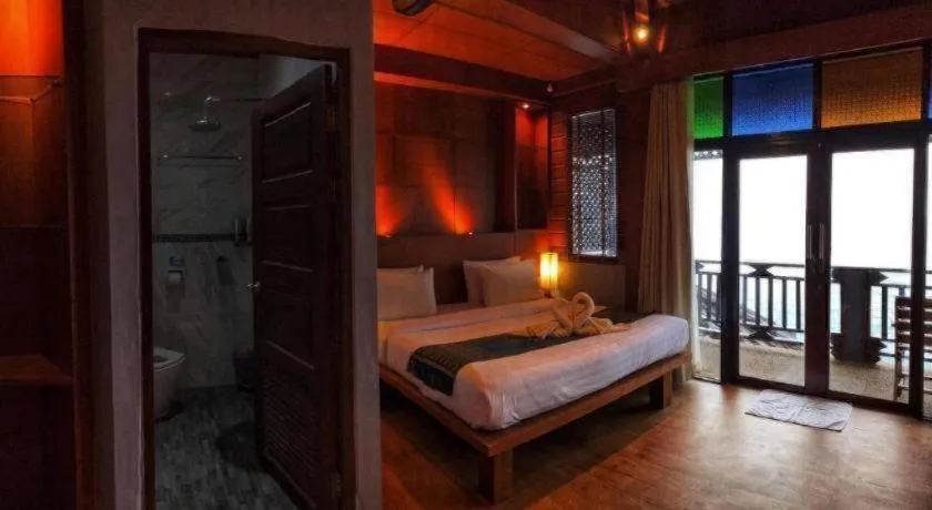 Bed in Diamond Cliff Beach Lanta Resort