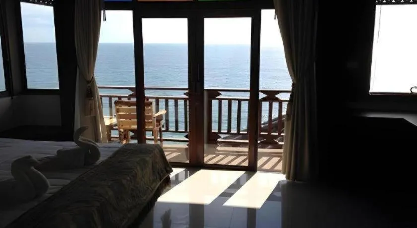 Bed in Diamond Cliff Beach Lanta Resort