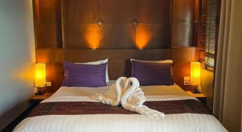 Bed in Diamond Cliff Beach Lanta Resort