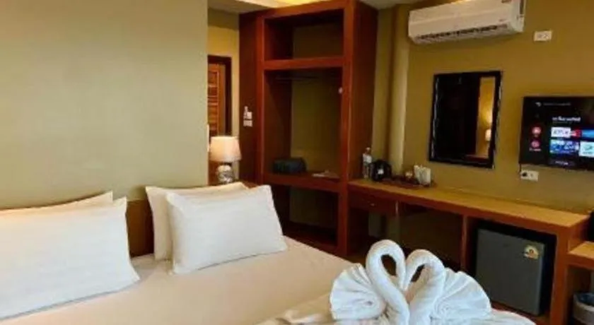 Bed in Diamond Cliff Beach Lanta Resort