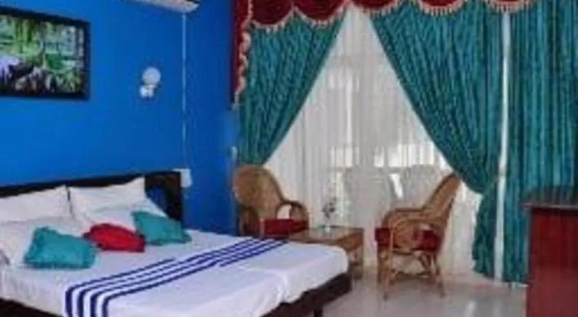 Bed in Jeevan Ayurvedic Beach Resort