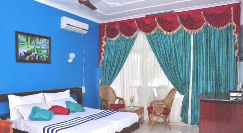 Bed in Jeevan Ayurvedic Beach Resort