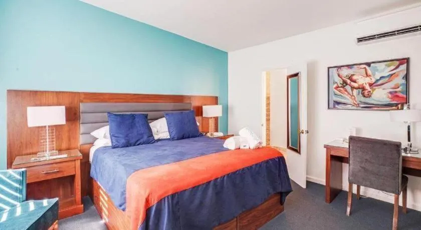 Bed in INNdulge Iconic Gay Men's Resort