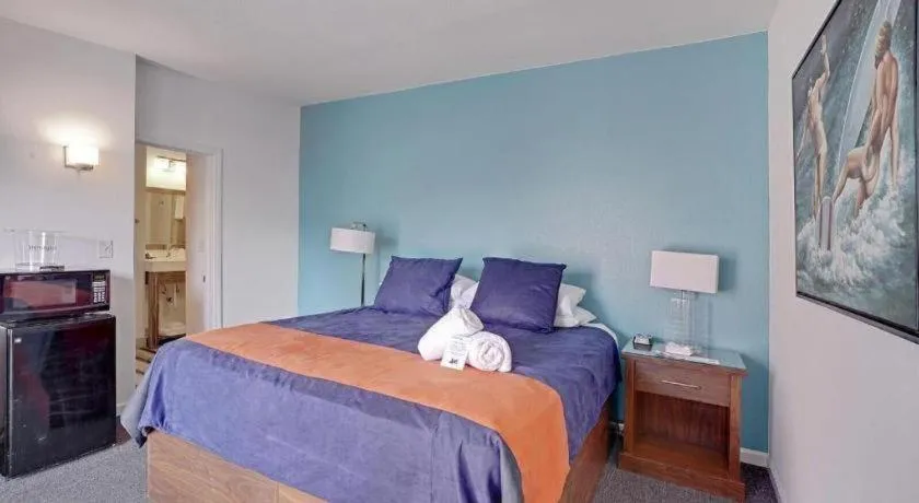 Bed in INNdulge Iconic Gay Men's Resort